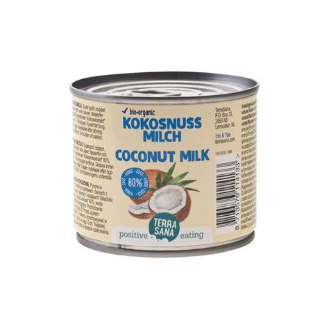geöffnete Dose Kokosmilch und geröstete Kokosraspeln