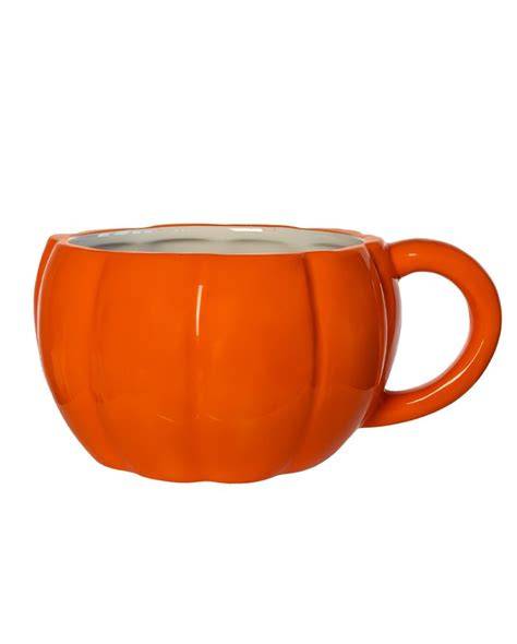 herbstliche szene mit kürbis, tasse kaffee und kuchenstück