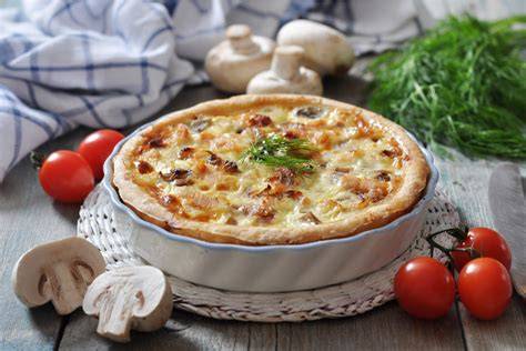 herzhafte Quiche mit Kräutern und Champignons