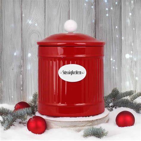 rote runde Blechdose mit Schneeflocken und Lindor-Kugeln